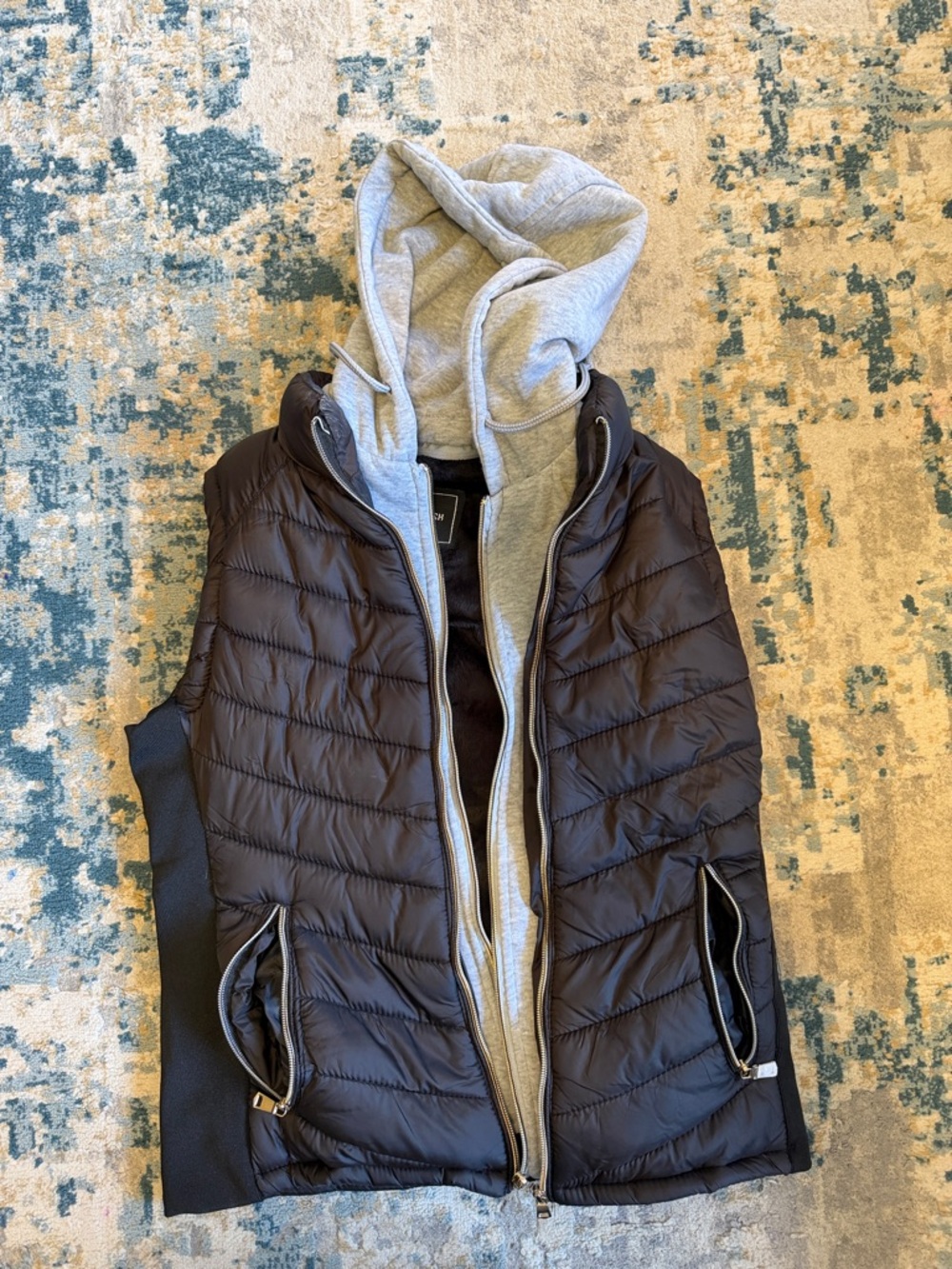 Lightweight Black Quilted Vest with Gray Hoodie Layer